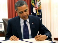 Obama_signing_bill