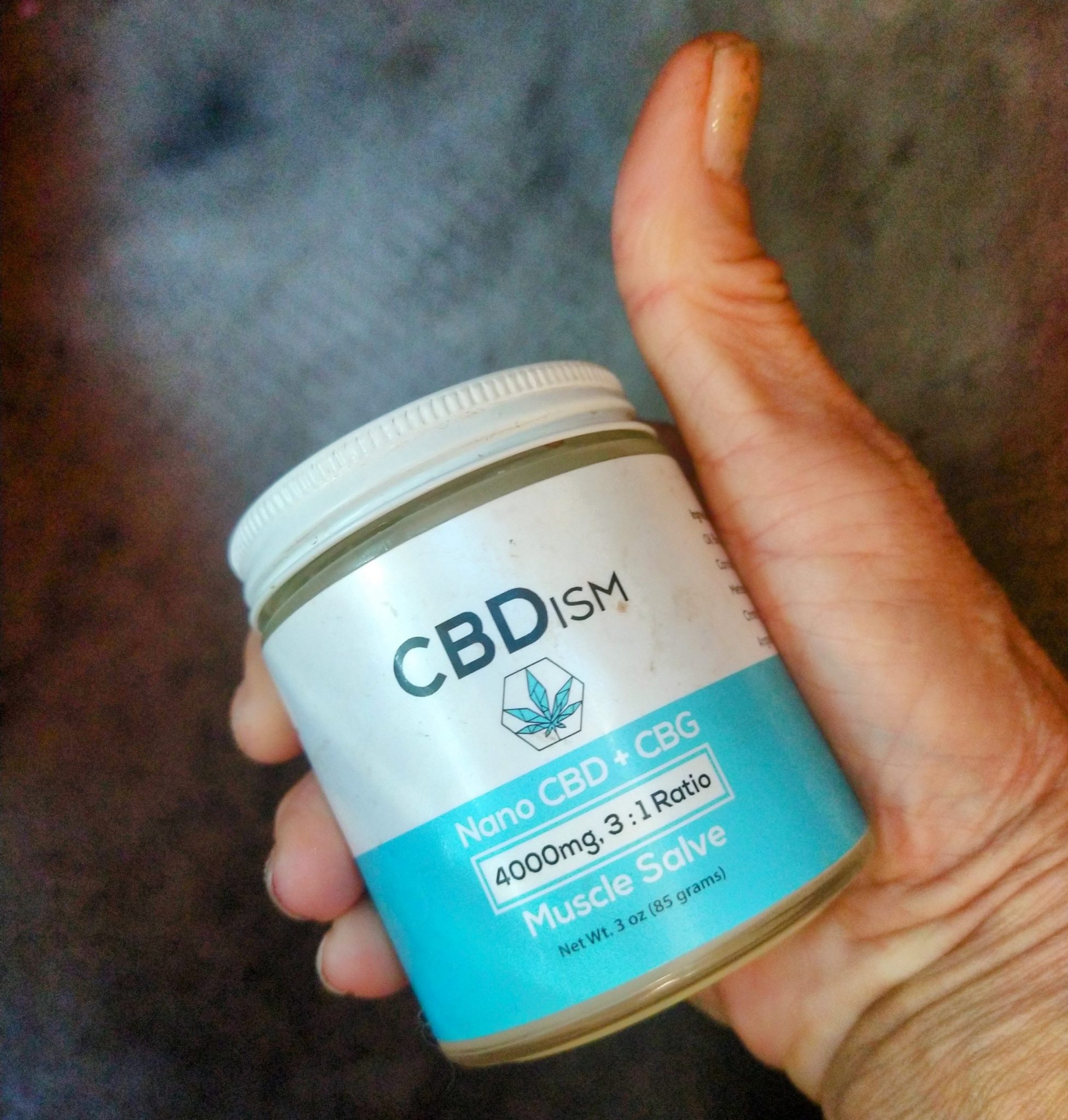 cbdism muscle salve in hand